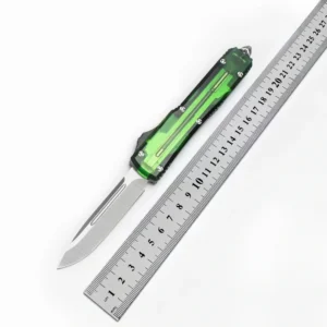 switchblade mes OTF met groen doorschijnend handvat